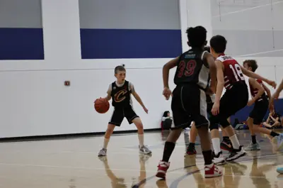 young children playing basketball