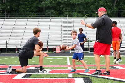 coach showing a player what to do