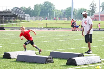 kid doing football drills