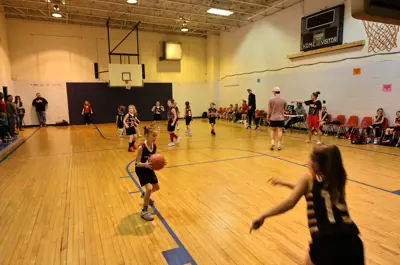 young children playing basketball