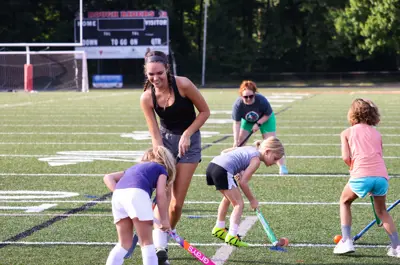 kids playing field hockey