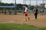 man throwing a softball