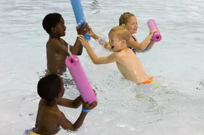 campers playing in the pool