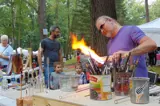 man using fire to create an art piece