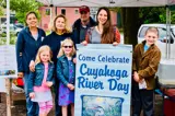 People standing with Cuyahoga River Day sign