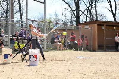 baseball player hitting the ball