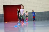 Young girl playing field hockey