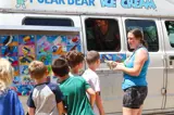 campers getting ice cream from an ice cream truck