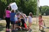 campers getting a water bucket thrown on them
